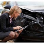 insurance adjuster looking at damages insurance adjuster looking at damages